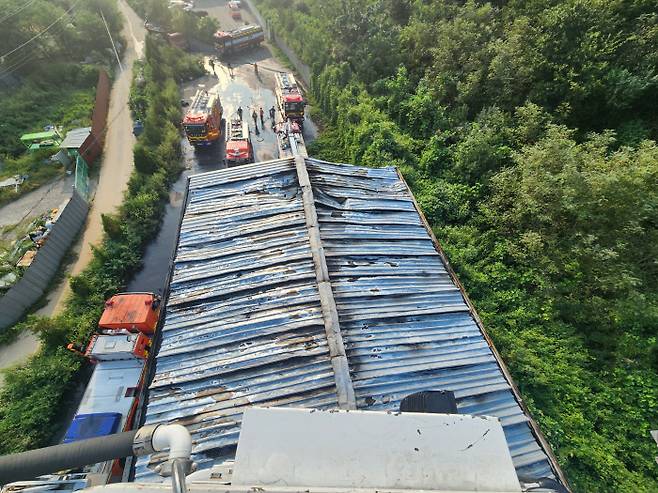 Holes are seen on the roof of a warehouse in Gwangju, Gyeonggi Province, after a fire caused by North Korea’s trash balloon broke out on September 8. Yonhap News