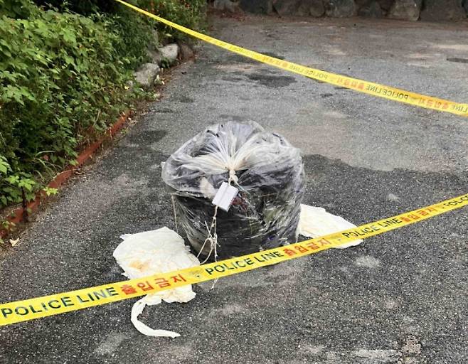 This file photo, provided by the Gangwon Province fire services, shows a bundle of trash presumed to be sent by North Korea in Chuncheon, 75 kilometers northeast of Seoul, on Sept. 7. (Yonhap)