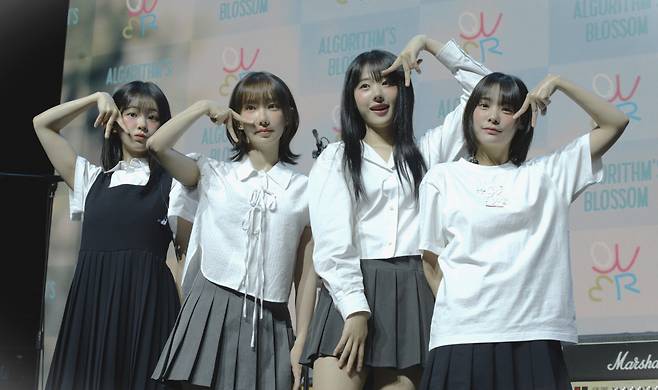 From left: QWER members Chodan, Magenta, Hina and Siyeon pose for a photo during the press conference held at Sinchon, Mapo-gu, Seoul, Monday. (Kwon Min-seo/The Korea Herald)