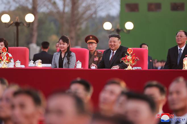 North Korean leader Kim Jong-un (right) and his daughter, widely believed to be named Ju-ae, attend a celebratory performance and banquet marking the 79th anniversary of the Workers' Party of Korea's founding at the party's central cadres training school on Oct. 10. This image was provided by the state-run Korean Central News Agency the following day. (Yonhap)