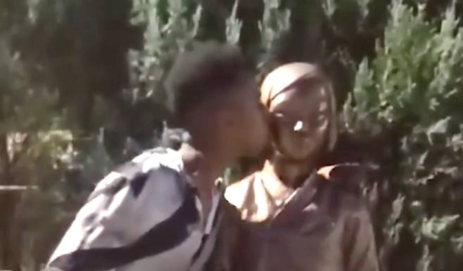 Johnny Somali kisses the Statue of Peace in a video uploaded on Oct. 9. [SCREEN CAPTURE]
