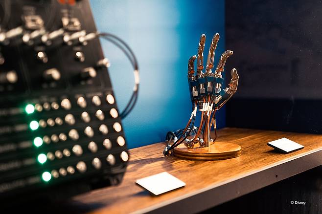 Installation view of the ″Innoventions″ section of “Disney100: The Exhibition,” featuring an electric hand created for the Walt Disney World Resort in Florida [EXHIBITION HUB ASIA]