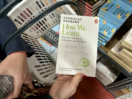 One of the books that Alyona Koneva, 28, picked was “How We Learn: The New Science and the Brain” (2020) by French neuroscientist Stanislas Dehaene. “I used to really like fiction, but I think I read too much [of it], so now, I’m trying to shift my interest to nonfiction books as well," she said. [LEE JIAN]