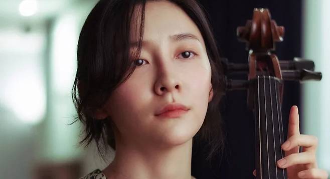 Actress Park Ji-hyun plays Mi-joo, a mysterious cellist who falls in love with an orchestra conductor in Director Kim Dae-woo’s new film “Hidden Face,” which was released on November 20. Courtesy of NEW