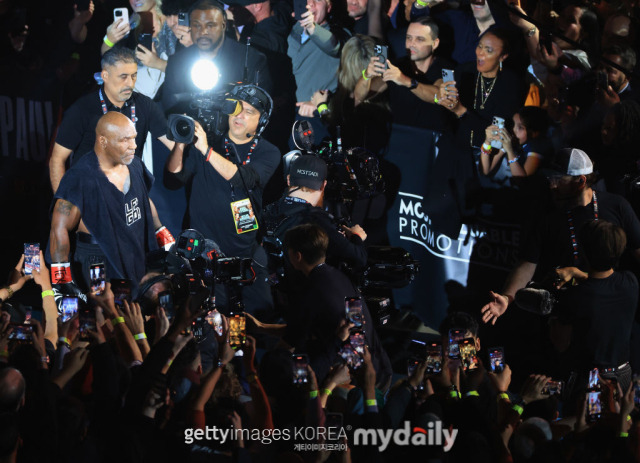 Mike Tyson enters for his match with Jake Paul./Getty Images Korea