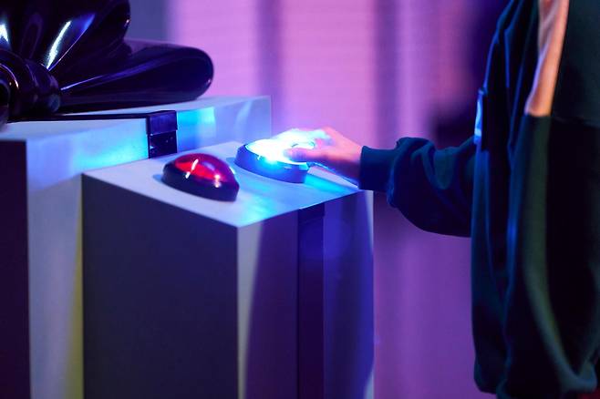 A participant makes a choice to stay or opt out of the games in season two of "Squid Game." (Netflix)