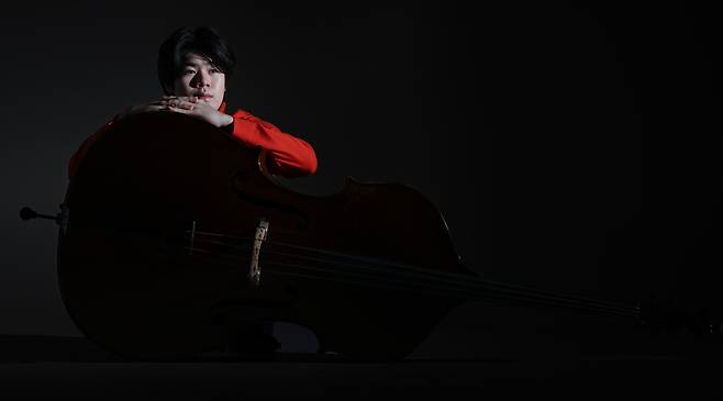 Double bassist Ryu Si-heon poses for photos during an interview with The Korea Herald on Dec. 26, 2024. (Lee Sang-sub/The Korea Herald)