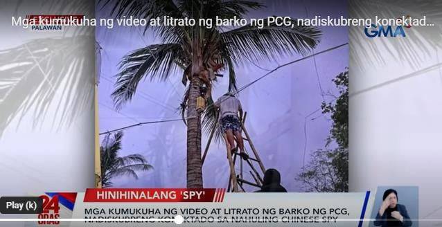 팔라완섬의 한 휴양지에서 1월 하순 중국인들이  야자나무 높은 곳에 필리핀 해안경비함 동향을 감시할 CCTV를 설치하고 있다. /GMA 캡처