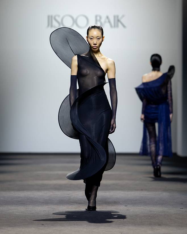 Models wear clothing from Jisoo Baik's collection at 2025 fall-winter Seoul Fashion Week at Dongdaemun Design Plaza in Seoul on Feb. 8. (The Opening)