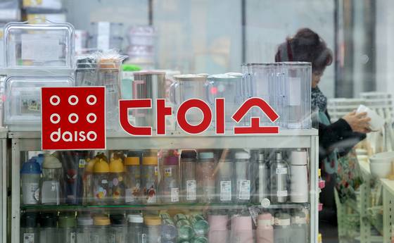 A customer shops at a Daiso store in Yongsan District, central Seoul, on Dec. 13, 2023. [NEWS1]