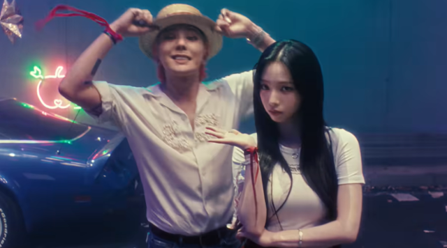 지드래곤과 카리나의 모습. 'TOO BAD' 티저 영상 캡처