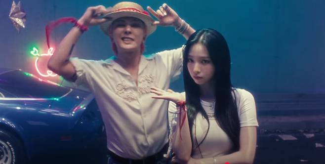 G-Dragon (left) and Karina of aespa appear on the teaser video for "Too Bad." (Youtube screenshot)