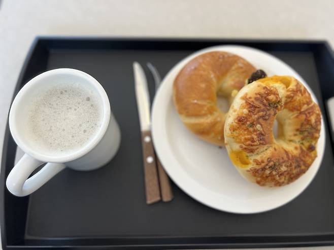 A butter salt bagel and basil tomato bagel are served at Bake Mogul in Seongdong-gu, eastern Seoul. (Park Jun-hee/The Korea Herald)