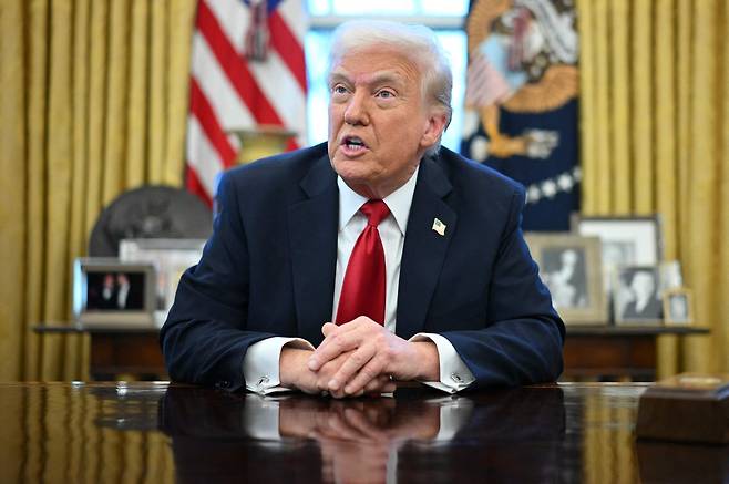 US President Donald Trump announces tariffs on auto imports in the Oval Office of the White House in Washington on Wednesday. (AFP)
