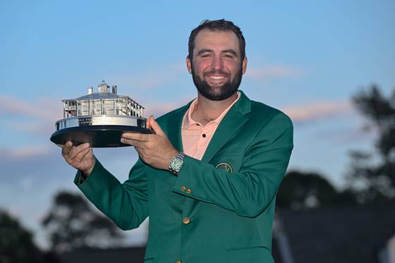 Scottie Scheffler poses with the winner's trophy as the 2024 Masters champion after the final round of the Masters Tournament at Augusta National Golf Club in Augusta, Georgia on April 14, 2024.  [GETTY IMAGES]