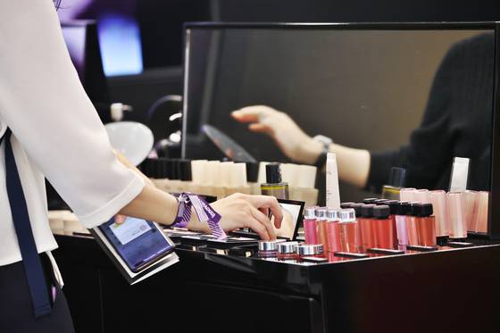 A visitor looks at beauty products displayed at a booth at the Kurly Beauty Festa 2024 on Oct. 10, 2024. [YONHAP]
