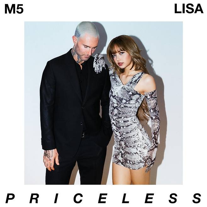 Adam Levine (left) poses with Lisa in the album artwork for Maroon 5's new single "Priceless (Ft. Lisa)," released Friday. (Universal Music)