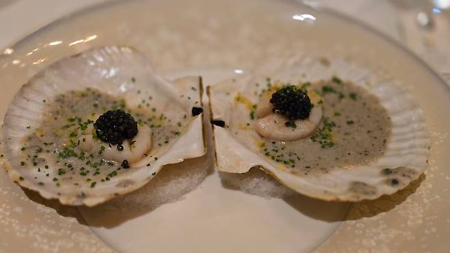 Scallop and beef cartilage served with a sauce made from Iberico ham using the extraction technique, topped with Osetra caviar. /STAY Seoul