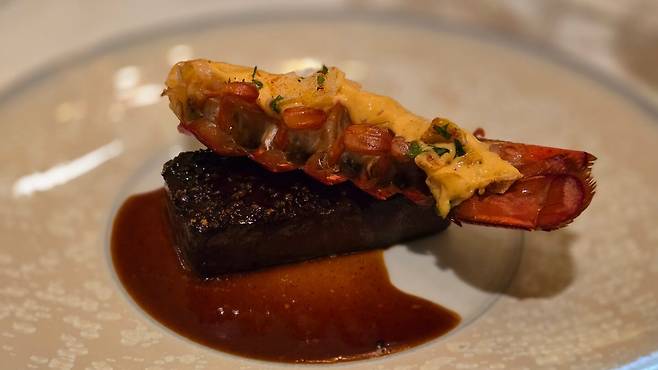 Surf and turf featuring lobster and premium Hanwoo mille-feuille, served with Chauron sauce and roasted sesame oil. /STAY Seoul