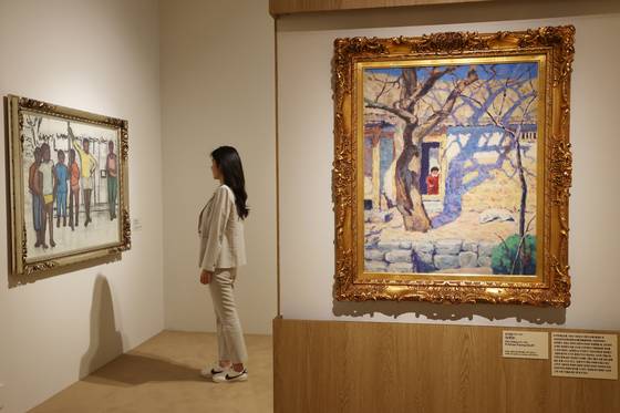 오지호의 대표작 '남향집'(오른쪽)과 마지막 작품 '세네갈의 소년들'. 국립현대미술관 과천의 상설전 '한국근현대미술 Ⅰ'에는 오지호ㆍ이중섭 등의 전시장을 따로 마련해 이들 화가를 특별 조명했다. 연합뉴스