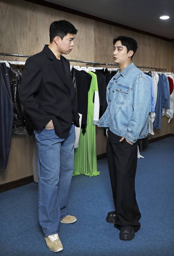 Fashion brand Leje's designers Je Yang-mo, left, and Kang Ju-hyeong, pose for photos before the interview with the Korea JoongAng Daily at its showroom in Jung District, central Seoul, on April 23, 2025.[PARK SANG-MOON]
