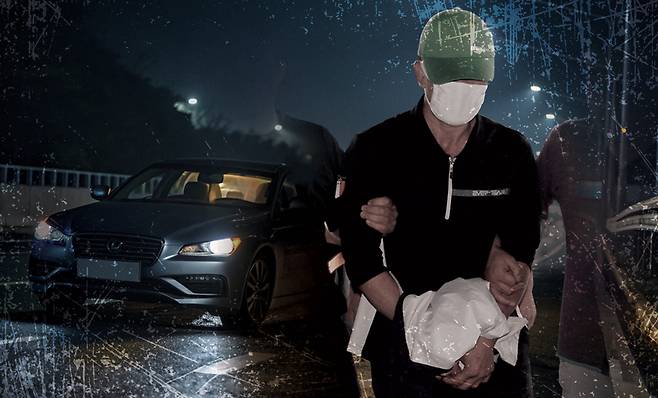 2007년 7월 이기영이 연쇄살인 혐의로 경찰에 압송되고 있다. ⓒ뉴시스