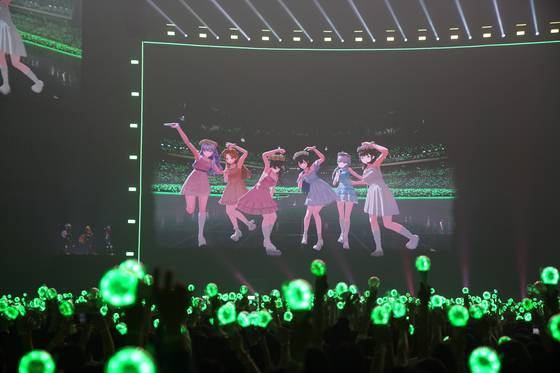 Virtual girl group Isegye Idol takes a photo with fans during the Isegye Festival held at the Gocheok Sky Dome in western Seoul on May 17. [PARABLE ENTERTAINMENT]