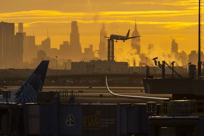Planes at Newark Liberty International Airport at dawn in Newark, N.J., May 7, 2025. Most flights destined for Newark Liberty International Airport were being delayed at their origin airports by more than an hour and 40 minutes on Monday, May 12, 2025, because of a shortfall in air traffic control staffing. (Dakota Santiago/The New York Times)