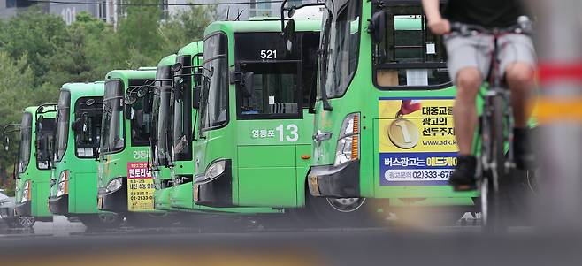Seoul village buses are parked at a depot in the capital on May 22. /News1