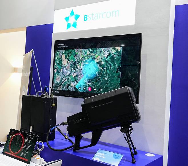 The Hybrid Drone Gun, a backpack-style anti-drone system developed by drone defense firm Bstarcom, is displayed at the Korea Pavilion during LIMA 2025 in Langkawi, Malaysia, Wednesday. (Korea Defense Industry Association)