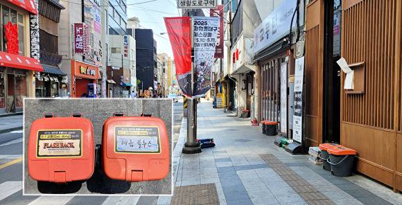 교동 음식물 수거용기 ‘실명제’에 따른 스티커 부착 용기 [사진=중구청]