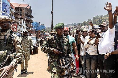 지난 2월 민주콩고 동부 부카부를 장악한 투치족 반군 M23 대원들 [EPA 연합뉴스 자료사진. 재판매 및 DB 금지]