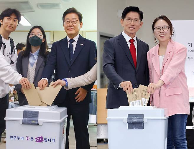 Presidential candidates Lee Jae-myung, left, and Kim Moon-soo cast their ballots during the first day of the two-day early election on May 29 for the 21st presidential election of Korea. [NEWS1]