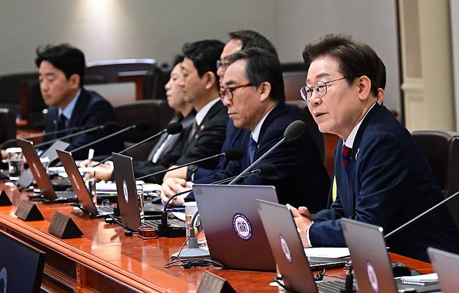 Newly elected President Lee Jae-myung, far right, speaks during his first Cabinet meeting at the presidential office in Yongsan District, central Seoul, on June 5. Foreign Minister Cho Tae-youl, who was appointed by ousted President Yoon Suk Yeol, is seated to the left of Lee. [JOINT PRESS CORPS]