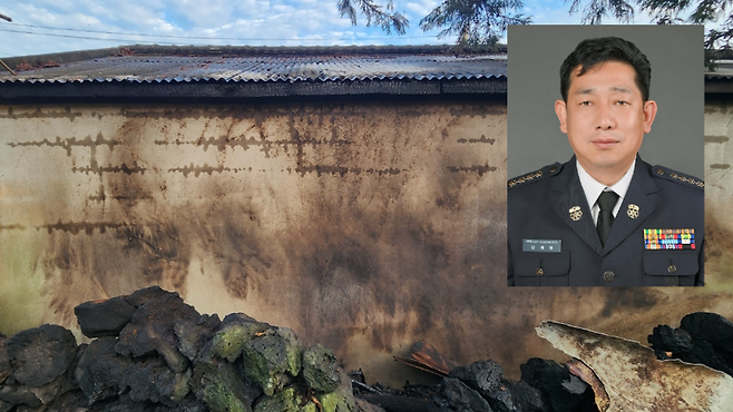 김재영 조천의용소방대장과 진화가 이뤄진 과수원 인근 건물 담벼락 (제주소방안전본부 제공)