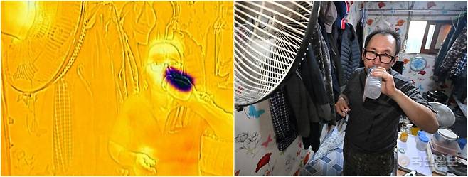 한낮 최고 기온이 30도 안팎까지 오른 9일 서울 영등포구 쪽방촌에 거주하는 한 어르신이 더위를 피하기 위해 선풍기 바람을 쐬고 있다. 사진 속 화상카메라에서 높은 온도는 붉은색으로, 낮은 온도는 푸른색으로 표시된다.