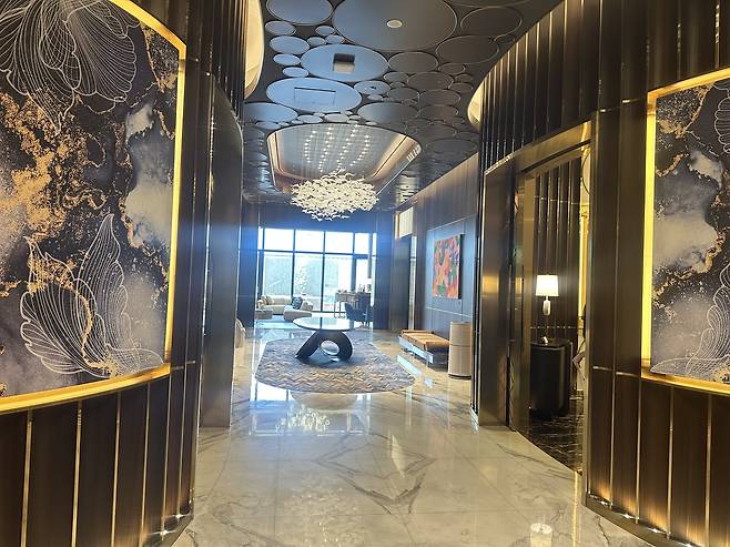 A chandelier hangs above a hallway inside a private villa, not available to the public, at Inspire Hotel [WOO JI-WON]