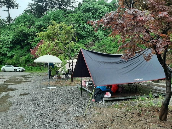 비오는 날 캠핑. 기사 내용과 직접적인 연관 없는 이미지. [사진 출처 = 연합뉴스]