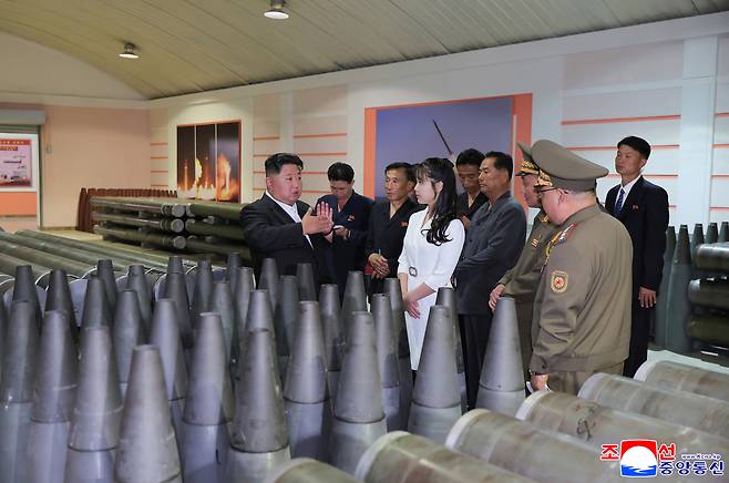 This photo, carried by North Korea's official Korean Central News Agency on June 14, 2025, shows the North's leader Kim Jong-un (left) inspecting a munitions factory the previous day to review the state of the production of artillery shells in the first half of the year. (Yonhap)