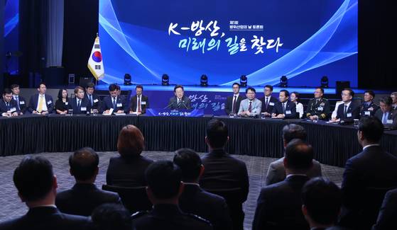 President Lee Jae Myung, center, speaks at an event to commemorate the inaugural K-Defense Day attended by leading Korean defense industry representatives and officials at the Grand Hyatt Seoul hotel in central Seoul on July 8. [JOINT PRESS CORPS]