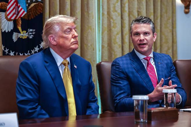 U.S. President Donald Trump, left, and Secretary of Defense Pete Hegseth attend a cabinet meeting at the White House in Washington on July 8. [UPI/YONHAP]