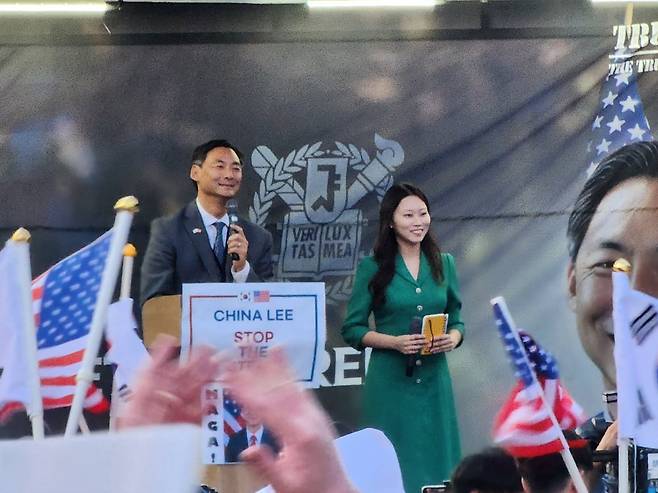 Morse Tan (left), former U.S. Ambassador-at-Large for Global Criminal Justice, speaks in support of former President Yoon Suk-yeol’s declaration of martial law during an even near Seoul National University in Seoul on July 15, 2025. /Yonhap