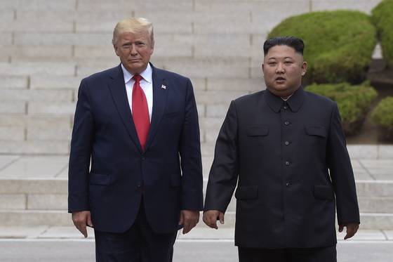U.S. President Donald Trump, left, meets with North Korean leader Kim Jong-un at the North Korean side of the Korean border at the village of Panmunjom in the demilitarized zone on June 30, 2019. [AP/YONHAP]