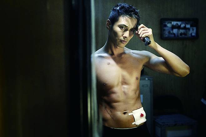 A scene from the film ″The Man From Nowhere″ (2010), in which actor Won Bin's character is referred to as an ajeossi (middle-aged man), who is firmly dedicated to protecting a young girl. [CJ ENM]