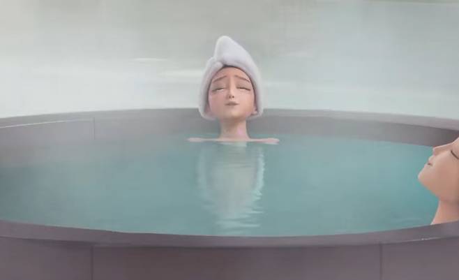 KPop Demon Hunters Rumi sinks into the bathhouse’s steaming waters. [SCREEN CAPTURE]