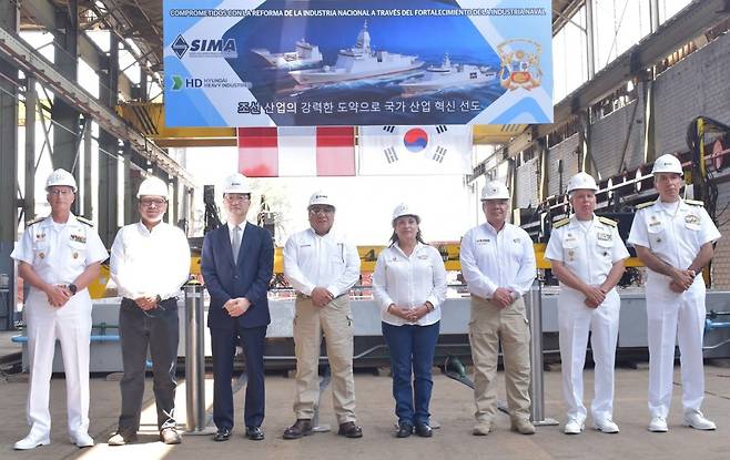 Officials pose at the groundbreaking ceremony of HD Hyundai Heavy Industries' joint project with SIMA Peru S.A. to build four warships for the Peruvian Navy, held at SIMA's shipyard, in this photo provided on Jan. 12. [HD HYUNDAI HEAVY INDUSTRIES]
