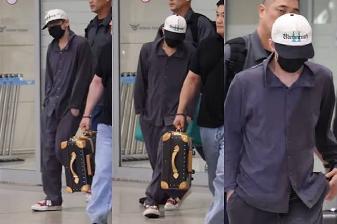 대한항공 일등석 파자마를 입고 입국하는 지드래곤. /사진=유튜브 티비텐 캡처