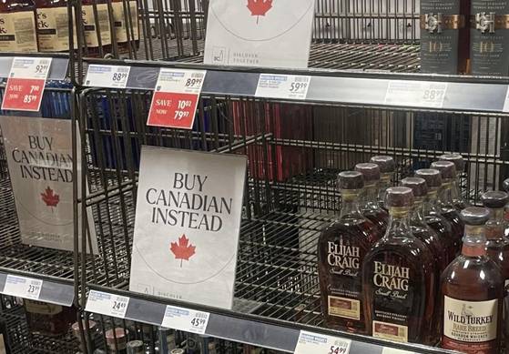 A photo of a supermarket in Canada, featuring a notice encouraging people to boycott U.S. brands and instead buy local goods. [SCREEN CAPTURE]