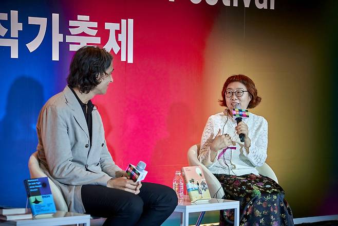 Lee Geum-yi (right) speaks during a talk session with Jonas Hassen Khemiri at the Seoul International Writers' Festival on Saturday. (LTI Korea)
