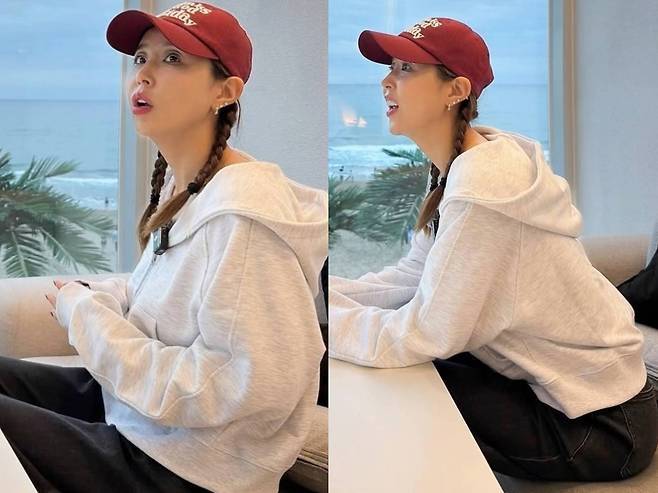 신지가 사랑스러운 양갈래 헤어스타일로 동안 미모를 뽐냈다.사진=신지 SNS